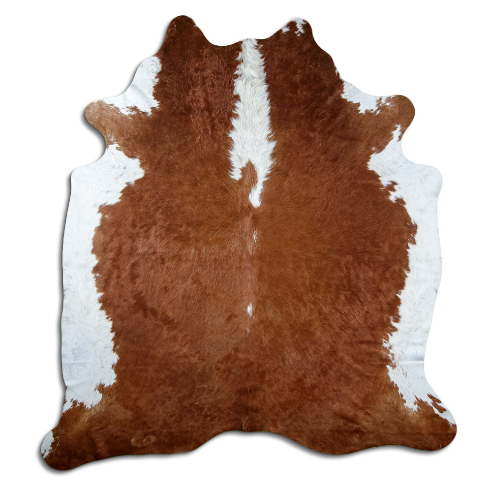 Bruin-witte koeienhuid, ongeveer 220 × 200 cm, van bovenaf gezien: precies de huid die je ontvangt