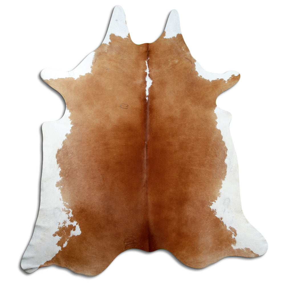 Bruin-witte koeienhuid, ongeveer 230 × 210 cm, van bovenaf gezien: precies de huid die je ontvangt