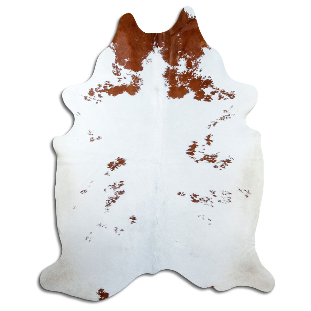 Bruin-witte koeienhuid, ongeveer 220 × 180 cm, van bovenaf gezien: precies de huid die je ontvangt