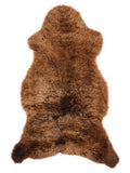 Bruine schapenvacht, ongeveer 110 × 55 cm, van bovenaf gezien: precies de vacht die je ontvangt